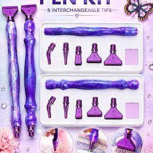 May include: A diamond painting pen kit featuring two purple marbled pens and two white storage trays. Each tray contains one pen and five interchangeable metal tips labelled with numbers 3, 6, and 9. The text reads DIAMOND PAINTING PEN KIT.