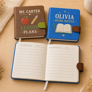 May include: Two small rectangular notebooks with magnetic closures, one brown and one blue. The brown notebook features an apple, pencil, and the text "MS. CARTER LESSON PLANS." The blue notebook features an open book and the text "OLIVIA BOOK NOTES."