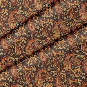 May include: A fabric featuring a dense paisley pattern in shades of dark brown, burnt orange, and golden yellow. The intricate design consists of teardrop-shaped motifs, swirling floral elements, and small circular accents across the surface.