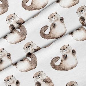 May include: White fabric with a repeating pattern of watercolor otters in shades of brown and tan. The otters are depicted in various poses, some upright and others on their backs.