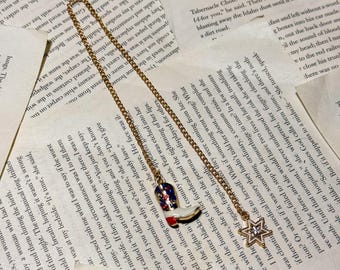 Kettingbladwijzer met op cowboy/westerse/romantisch geïnspireerde bedels