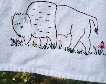 Hand embroidered bison on the prairie tea towel