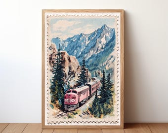 May include: Framed print featuring a vintage illustration of a pink train traveling through a mountain landscape. The artwork has a postage stamp-like border and is set in a light wood frame. The mountains are blue and the trees are green.