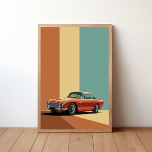 May include: Framed art print of a classic orange sports car. The car is set against a backdrop of vertical stripes in brown, yellow, and teal. The artwork is displayed on a wooden floor.