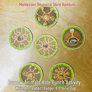 May include: Five circular educational cards featuring illustrations of animal burrows. Each card shows a cross-section of underground tunnels with a central animal, including a rabbit, mole, badger, prairie dog, and ants, surrounded by a green border.