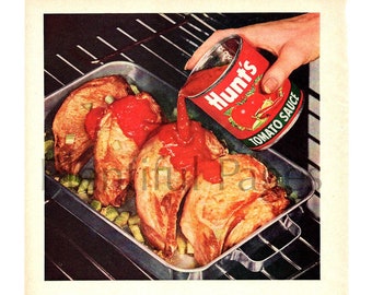 May include: A vintage advertisement for Hunt's Tomato Sauce featuring a close-up of a baking dish with pork chops and celery being topped with tomato sauce. The text reads "Baked Pork Chops...their Barbecued Flavor is really delicious!" and includes a recipe for the dish.