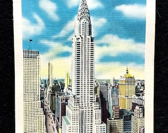 May include: Vintage postcard featuring the Chrysler Building in New York City. The iconic skyscraper is the focal point, surrounded by other buildings under a blue sky with clouds. The postcard has a white border and the text "CHRYSLER BUILDING, NEW YORK CITY".