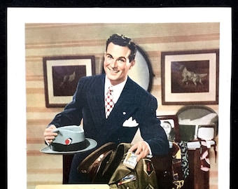 May include: A vintage advertisement for Chesterfield cigarettes featuring a man in a suit and a hat holding a pack of cigarettes. The ad text reads "Come on Chesterfield we're changing to a new outfit..." and "Yes, it's a lasting friendship... well-earned by Chesterfield's three top qualities... MILDNESS BETTER TASTE COOLER SMOKING" and "And when your G.I. Joe steps out of khaki into a blue pin-stripe and he's home for keeps, you'll again enjoy Chesterfields together and agree that nothing measures up to their... RIGHT COMBINATION WORLD'S BEST TOBACCOS They Satisfy CHESTERFIELD".