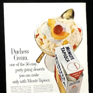 May include: A vintage advertisement for Minute Tapioca, featuring a dessert recipe called "Duchess Cream." The image shows a glass bowl filled with a creamy dessert topped with sliced peaches, maraschino cherries, and whipped cream. The text on the box reads "Minute Tapioca" and "Press in Here."