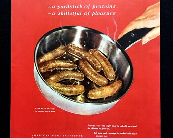 May include: A vintage advertisement on a red background featuring a silver skillet filled with browned sausages. The text reads Meat, a yardstick of proteins, a skilletful of pleasure, and includes American Meat Institute and Pure Pork Sausage.