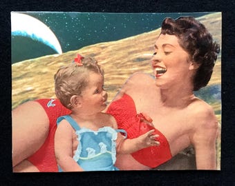 May include: A vintage collage featuring a woman and a baby on a beach with a celestial background. The woman wears a red bikini top, and the baby is in a blue swimsuit. The woman is laughing, and the baby is looking at her.