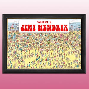 May include: A framed print depicting a busy beach scene with many people. The text "WHERE'S JIMI HENDRIX" is in red letters on a white banner above the beach illustration. The frame is black, and the overall image has a vibrant, colourful feel.