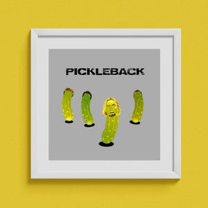 May include: A framed print with the word "PICKLEBACK" above four cartoon pickles. Three pickles have brown hair, and one has blonde hair and a beard. The background is grey.