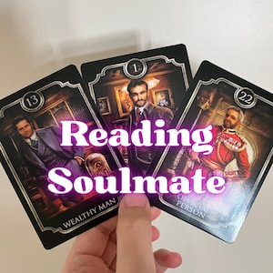 May include: Three tarot cards with images of men in suits and military attire. The cards have a black background with gold accents and the words "Reading Soulmate" in a glowing purple font. The cards are held by a hand.