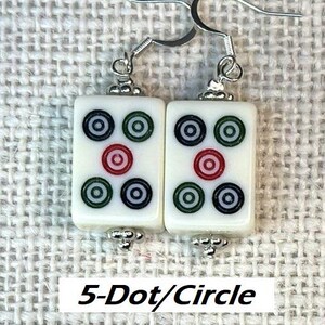May include: Earrings with rectangular white tiles, each displaying a 5-dot/circle pattern in red, green, and black. The earrings have silver-tone hooks and decorative beads. The text "5-Dot/Circle" is on a white rectangle.
