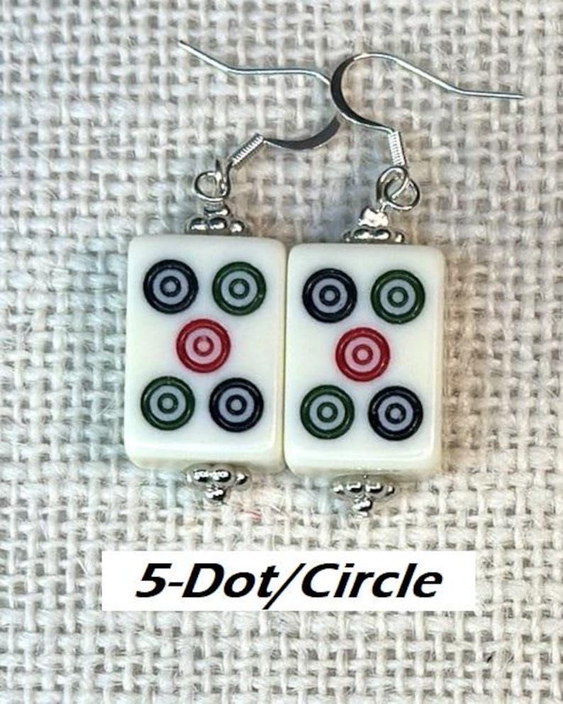 May include: Earrings with rectangular white tiles, each displaying a 5-dot/circle pattern in red, green, and black. The earrings have silver-tone hooks and decorative beads. The text "5-Dot/Circle" is on a white rectangle.