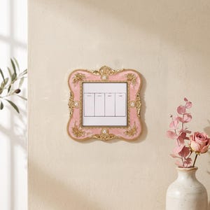 May include: A square light switch cover plate featuring a pink enamel finish with gold-toned floral accents and embedded white pearls. The frame surrounds a central white panel containing four vertical rectangular toggle switches arranged side by side.