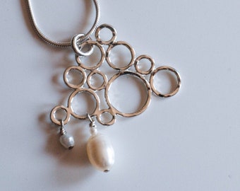 Pearl cloud necklace, silver rain cloud pendant, rain clouds necklace with pearl rain drops handmade by Calgary jeweller Melissa Pedersen
