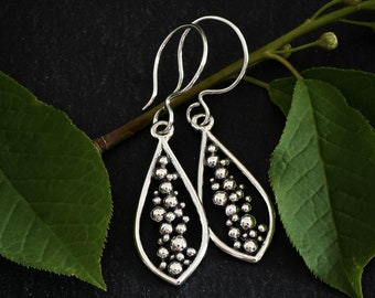 Teardrop pod earrings in solid sterling silver, seed pod jewelry by Calgary artist Melissa Pedersen, silver drop earrings, gardener gift