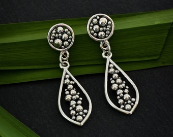 Sterling silver statement earrings, seed pod drop earrings, large teardrop earring, metalsmith jewelry by silversmith Melissa Pedersen