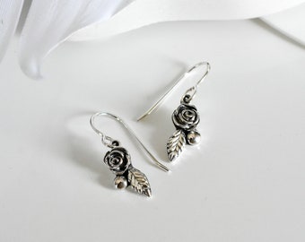 Rose earrings handmade in solid sterling silver by Canadian jewellery designer Melissa Pedersen. small rose jewelry, silver floral earrings