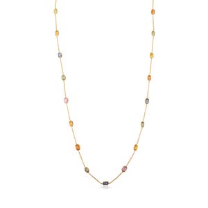 May include: A gold necklace with a delicate chain, adorned with a series of rectangular gemstones in various colours. The gemstones include yellow, orange, pink, blue, and green. The necklace is set against a white backdrop.