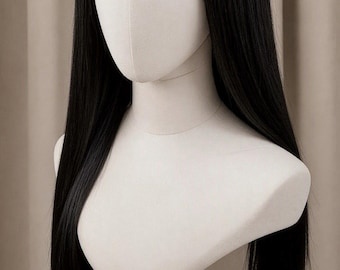 May include: A long, straight black wig with blunt-cut bangs styled on a white mannequin head. The hair is smooth, dark, and falls past the shoulders, featuring a centre part and a fringe that covers the forehead, displayed on a black stand.