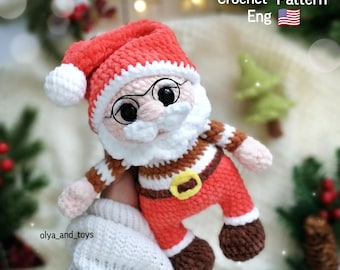 May include: A handmade crochet Santa Claus doll with a red hat, suit, and brown boots. The doll has a white beard, glasses, and a gold belt buckle. The image includes the text "PDF Crochet Pattern Eng".