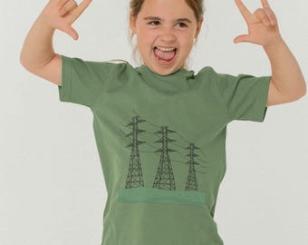 May include: A green short-sleeved t-shirt with a graphic of three black power lines and towers. The shirt has a crew neck and is made of a soft, comfortable fabric.
