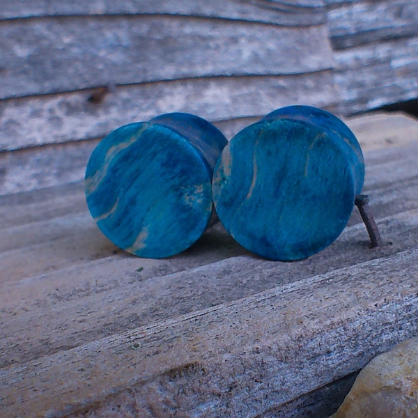 16mm Deep Blue gauges. Stabilized Curly quilted maple wood plugs. 5/8" gauge flesh plugs. Custom Body jewelry, ear plugs