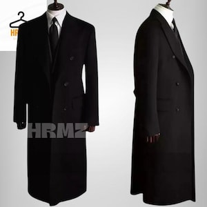 May include: A black double-breasted overcoat with a long length and a classic design.