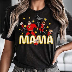 May include: Dark gray t-shirt featuring a cartoon graphic of a superhero family with the word "MAMA" in yellow letters. The superhero family is in red and black costumes with yellow stars.