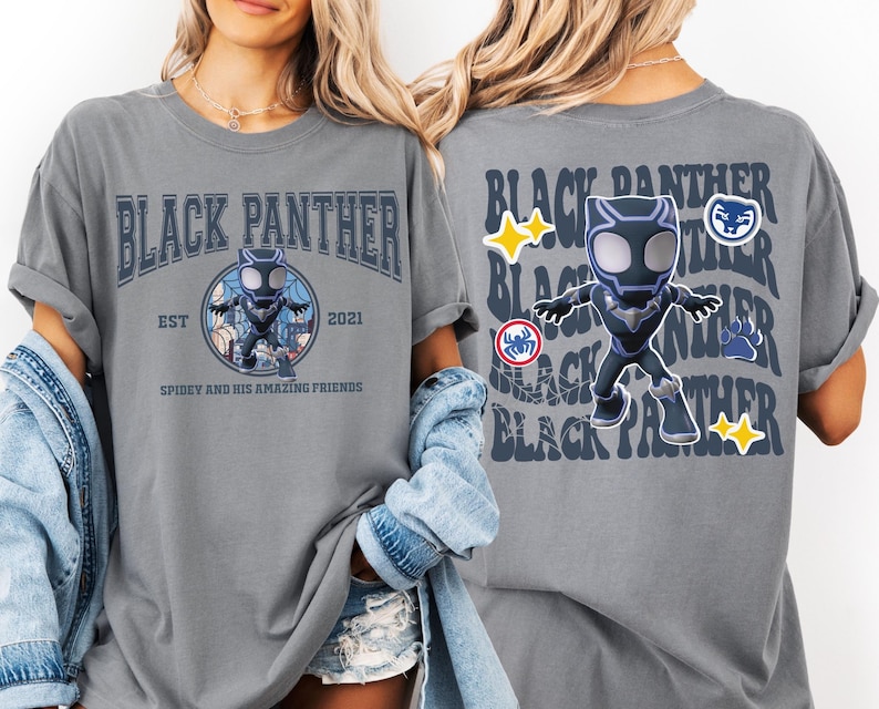 May include: Gray t-shirt featuring a Black Panther design. The front of the shirt has the words "Black Panther" above a cartoon image of the character. The back of the shirt repeats "Black Panther" with additional graphics.