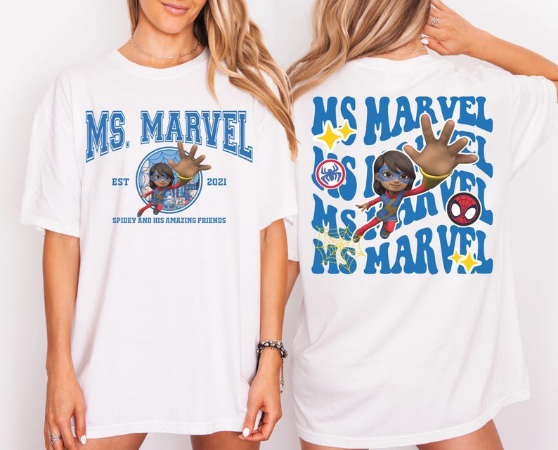May include: White t-shirt featuring the text "MS. MARVEL" in blue, with a graphic of Ms. Marvel and the text "SPIDEY AND HIS AMAZING FRIENDS". The back of the shirt repeats the text "MS MARVEL" with additional graphics.