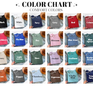 May include: A colour chart displaying Comfort Colors t-shirts in a range of shades, such as black, white, navy, and grey. Each shirt is presented with a decorative detail. The chart includes colours like red, crimson, and blue, with names like "Crunchberry" and "Espresso".