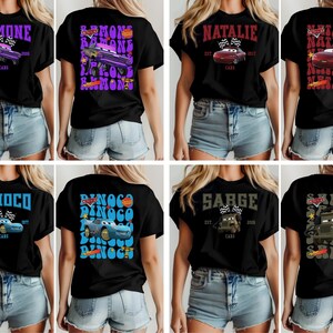 May include: Black t-shirts featuring various Cars movie characters, including Ramone, Natalie, Dinoco, and Sarge. Each shirt displays the character's name, a car graphic, and the word "Cars."