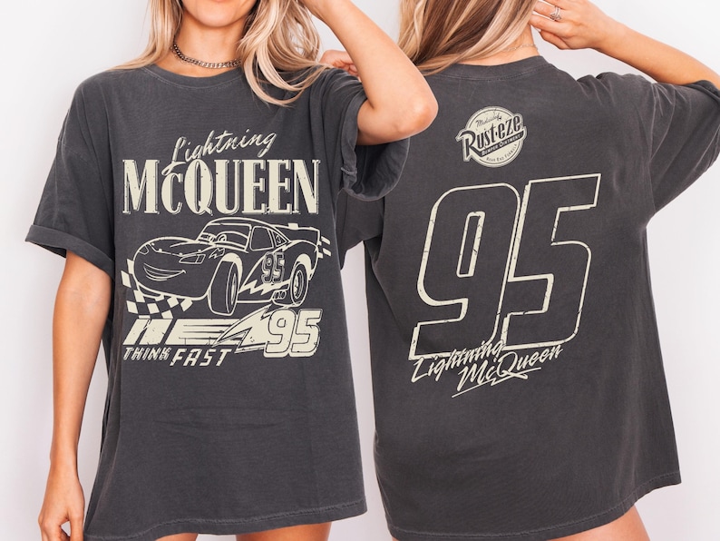 May include: Dark grey Lightning McQueen t-shirt. The front displays a graphic of the character and the text "Lightning McQueen", "95", and "Think Fast". The back of the shirt shows the number "95", the text "Lightning McQueen", and a "Rusteze" logo.