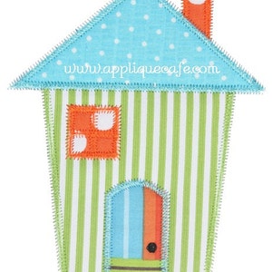 May include: A green and white striped house with a blue and orange door, a blue roof with white polka dots, and an orange chimney. The house has a white window with orange trim and white polka dots. The text "www.appliquecafe.com" is on the roof.