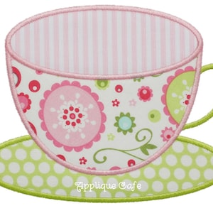 May include: A pink and green teacup and saucer with a floral pattern. The teacup has a pink and white striped interior. The saucer has a green background with white polka dots.