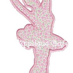 May include: Pink ballerina silhouette embroidery design with a floral pattern.