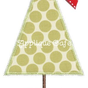 May include: A green and white polka dot Christmas tree applique with a red bow and a red, green, and white patterned base. Applique Cafe.