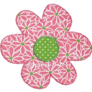 May include: A pink and green fabric flower applique with a white daisy pattern. The center of the flower is a green circle with white polka dots.