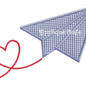 May include: A blue and white gingham paper airplane with a red heart string attached to it. The text "Applique Cafe" is written on the airplane.