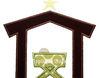 May include: A brown wooden manger with a green and white polka dot crib inside. A yellow star sits above the manger.