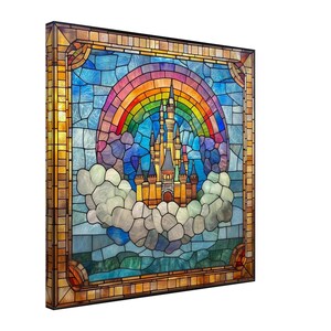 May include: Stained glass art piece featuring a colorful rainbow arching over a fairytale castle. The castle is set against a blue sky background, with fluffy white clouds below. The artwork is framed in a gold-toned border.