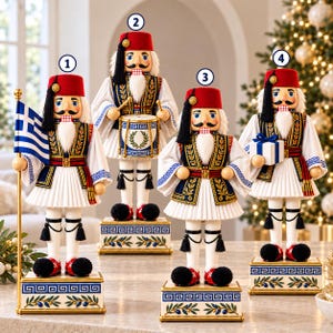 May include: Four nutcracker figurines wearing red fezzes, white shirts with wide sleeves, and pleated skirts. Each stands on a rectangular base decorated with a blue Greek key pattern and olive branch motifs, numbered one through four.