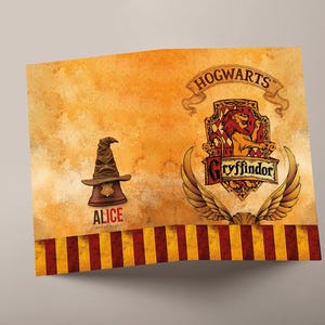 May include: A folded card with a Hogwarts theme. The card features the Hogwarts crest, a sorting hat, and the name "Alice". The background is a textured, aged parchment style with red and gold stripes.