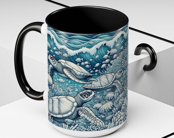 May include: A white ceramic mug with a black handle and rim. The mug features a blue and white illustration of sea turtles swimming in the ocean with coral and fish.