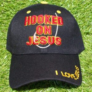 Hooked On Jesus Baseball Hat. Adjustable Black Cap. Jesus Hat. I Love Jesus Cap. Christian Gift. Jesus Loves You. Jesus Cap