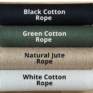 May include: Four spools of rope, from top to bottom: black cotton rope, green cotton rope, natural jute rope, and white cotton rope.